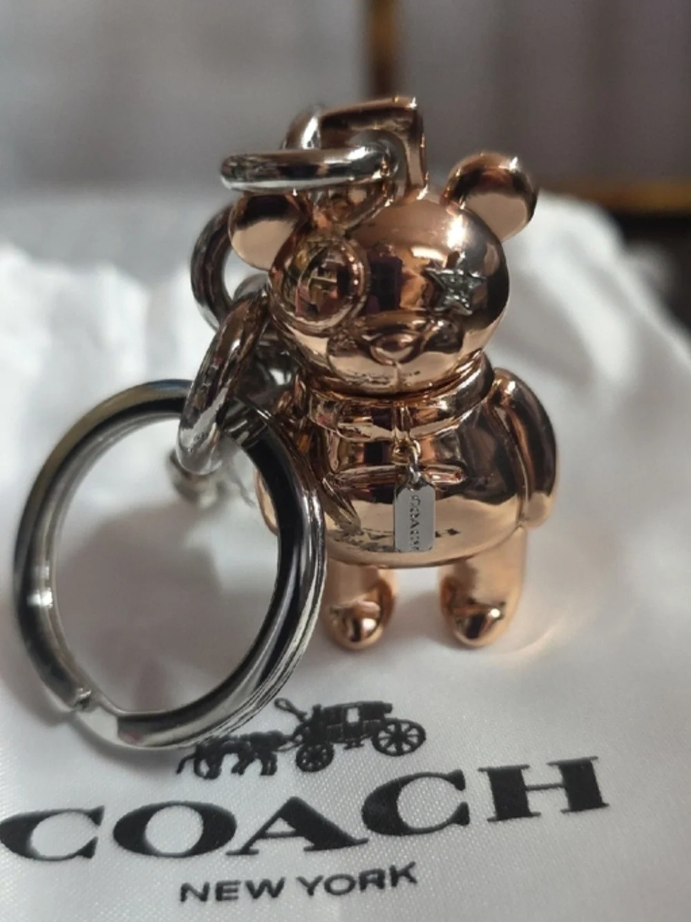 The official Rose Gold Coach 3D Mascot Bear Bag Charm & Keychain